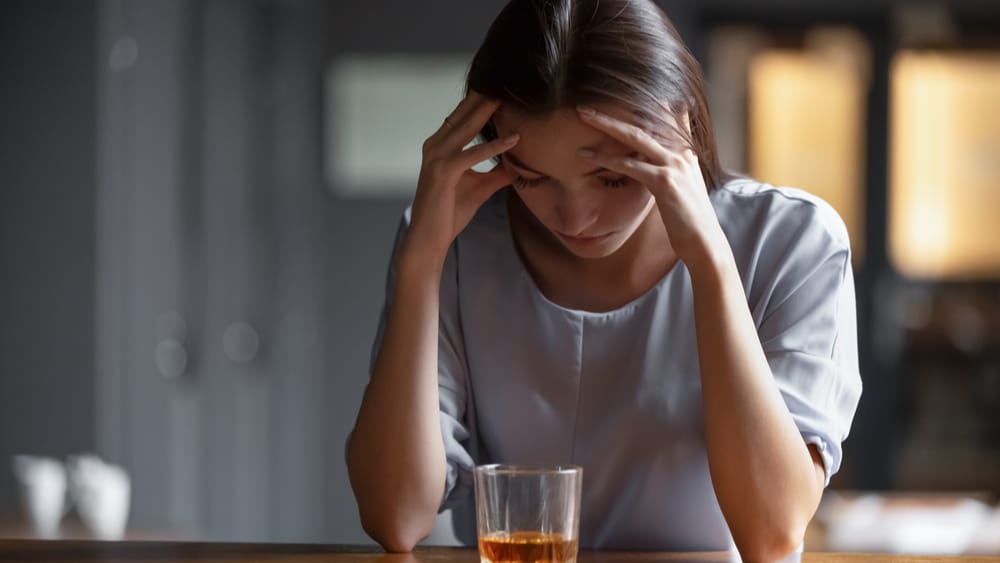 6 Ways to Know You Have a Drinking Problem North Jersey Recovery Center - A woman struggles with accepting the fact that she may have a drinking problem because of the present red flags when it comes to her alcohol use