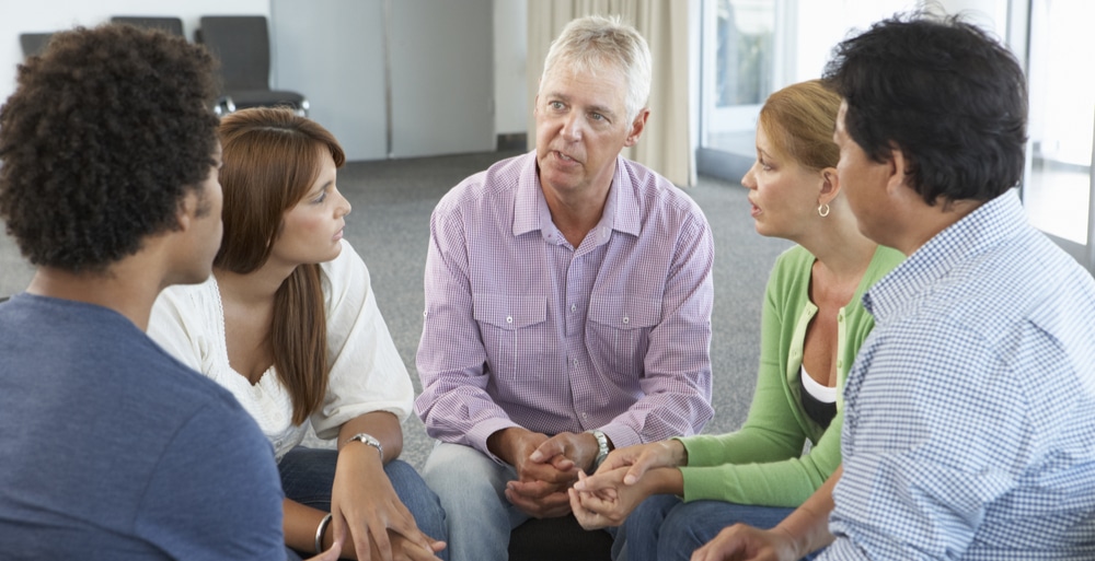 Outpatient Rehab for Drug Addiction North Jersey Recovery Center - A group of individuals in outpatient treatment attend an NA meeting for support and guidance to stay on the path to sobriety for their outpatient treatment plan