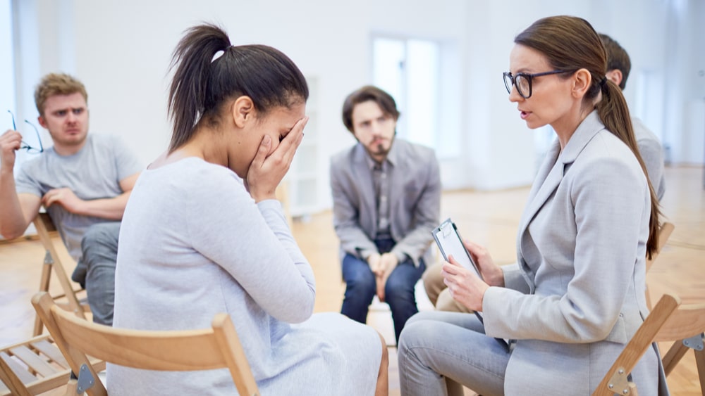 Alcohol Withdrawal and Detox North Jersey Recovery Center - An addiction specialist is running a group therapy session as part of an inpatient alcohol treatment program and is explaining to a new patient what to expect from the medically-supervised detox process and why taking Adderall for alcohol withdrawal is a dangerous combination.