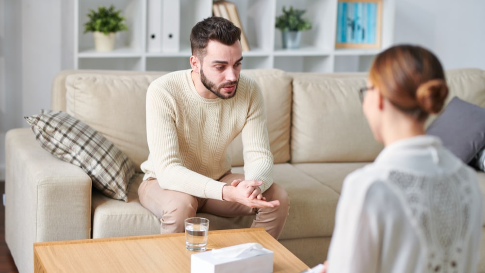 Dual Diagnosis Treatment Center North Jersey Recovery Center - A man engages in one-on-one counseling with a professional staff member at one of the many dual diagnosis treatment centers to determine any underlying mental health disorders that could be contributing to his addiction in one way or another.
