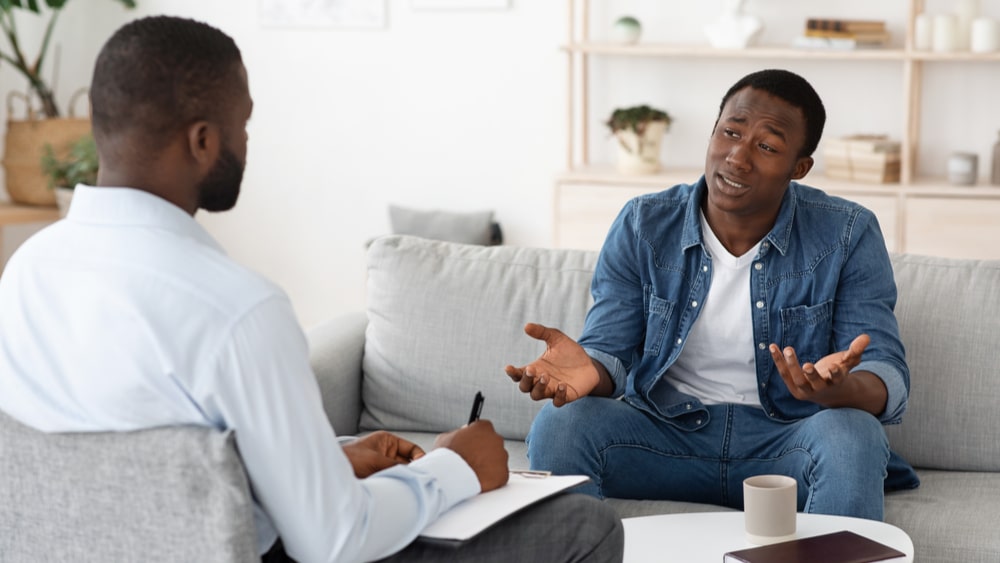 Prescription Drug Abuse North Jersey Recovery Center - A young man is engaging in a one-on-one counseling session with an experienced professional at a prescription drug abuse rehab facility to determine the best course of action for his treatment program.
