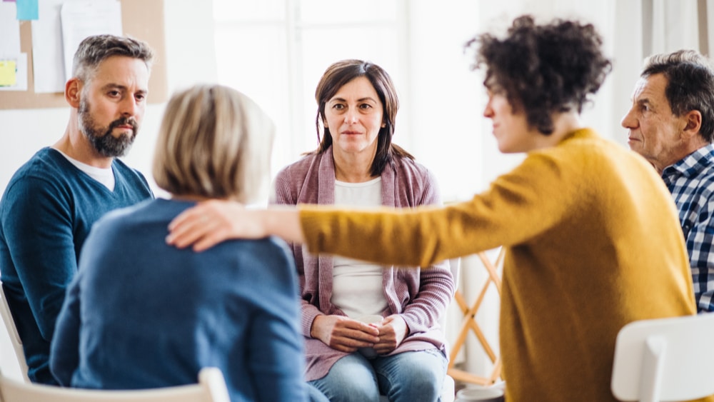 Smoking Crack North Jersey Recovery Center - A group of individuals who were addicted to smoking crack are attending a group therapy session as part of their residential rehab treatment program to work toward recovery and long-term sobriety.