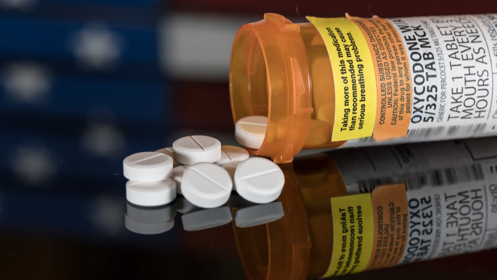 Snorting Oxycodone – Opioid Dependence - North Jersey Recovery Center - A bottle sits on its side with pills spilled out.