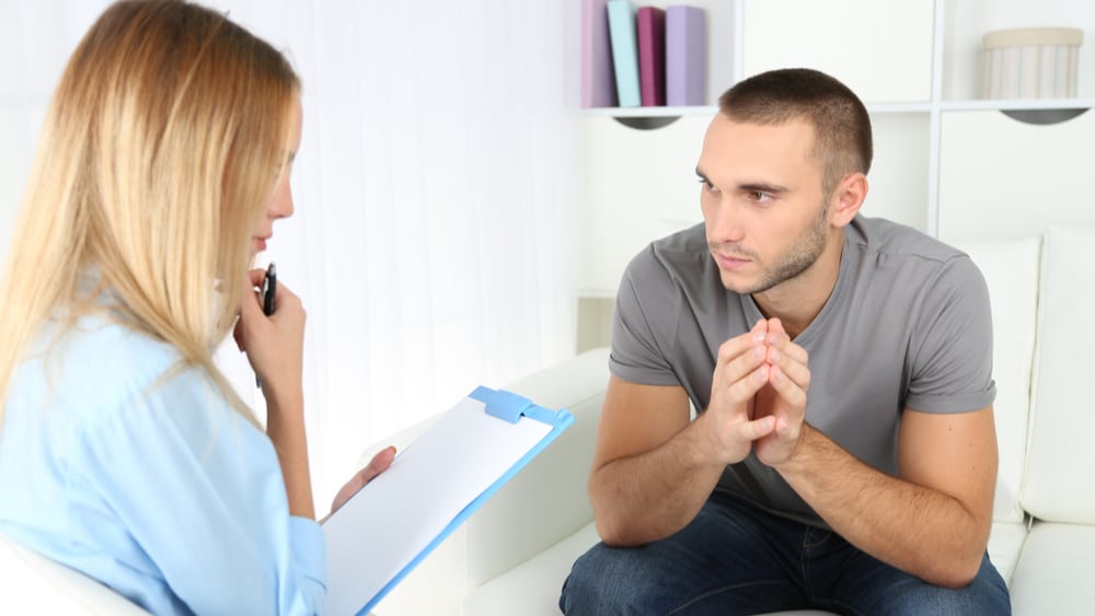 Adderall Addiction and Abuse North Jersey Recovery Center - A young man is meeting with an addiction specialist to discuss his Adderall addiction and determine a customized treatment plan to help him break free from his addiction.