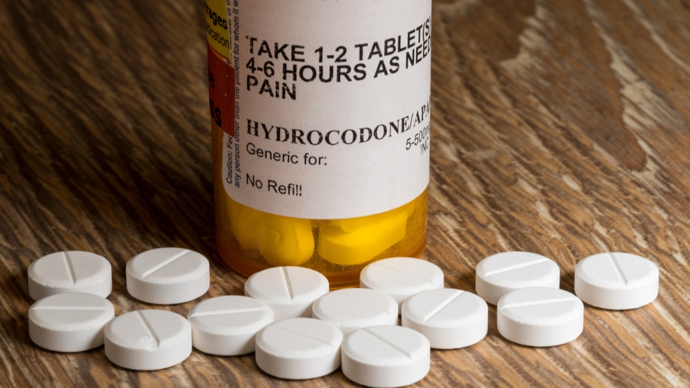 Hydrocodone Addiction and Abuse North Jersey Recovery Center - What is Hydrocodone? Here is an image of a Hydrocodone pill bottle with pills laid out in front of the bottle that can be highly addictive and lead to the need for professional treatment to break free from this addiction.
