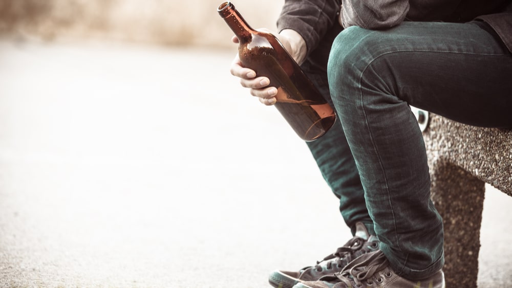 Is Alcohol a Depressant? North Jersey Recovery Center - A group of individuals attending an inpatient alcohol rehab for alcoholism is engaging in a group therapy session and discussing topics, such as: "Is alcohol a depressant?" as well as other helpful tools and resources to support each other as they continue on their journeys to recovery.