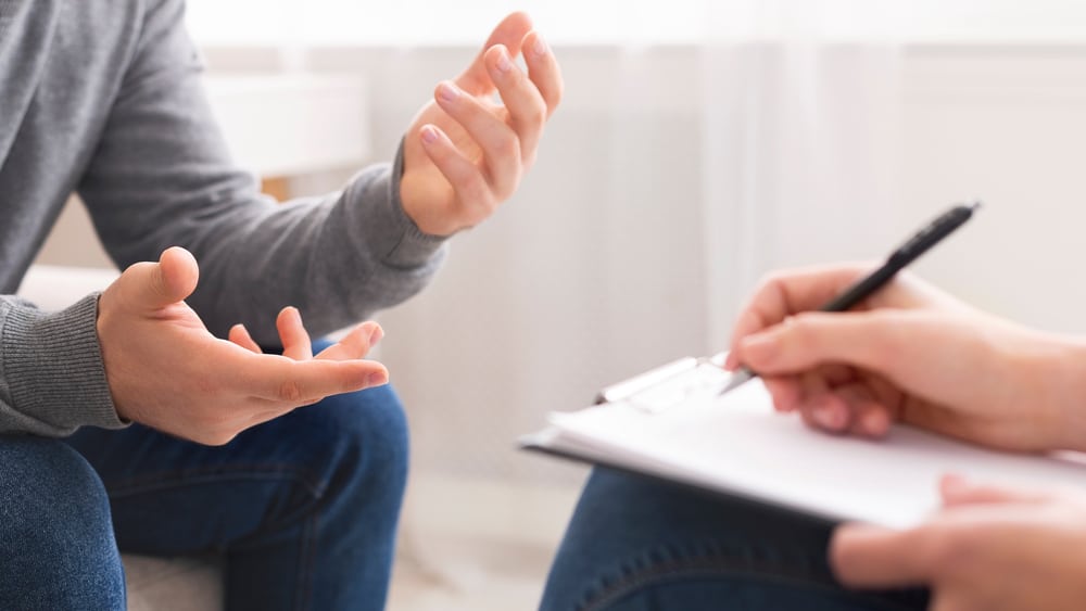 Zoloft Addiction and Withdrawal North Jersey Recovery Center - A man who is struggling to know: "Is Zoloft addictive?" is sitting with an addiction specialist to determine if he has an addiction to the antidepressant and if he requires treatment.