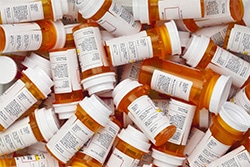 Pile of prescription pill bottles