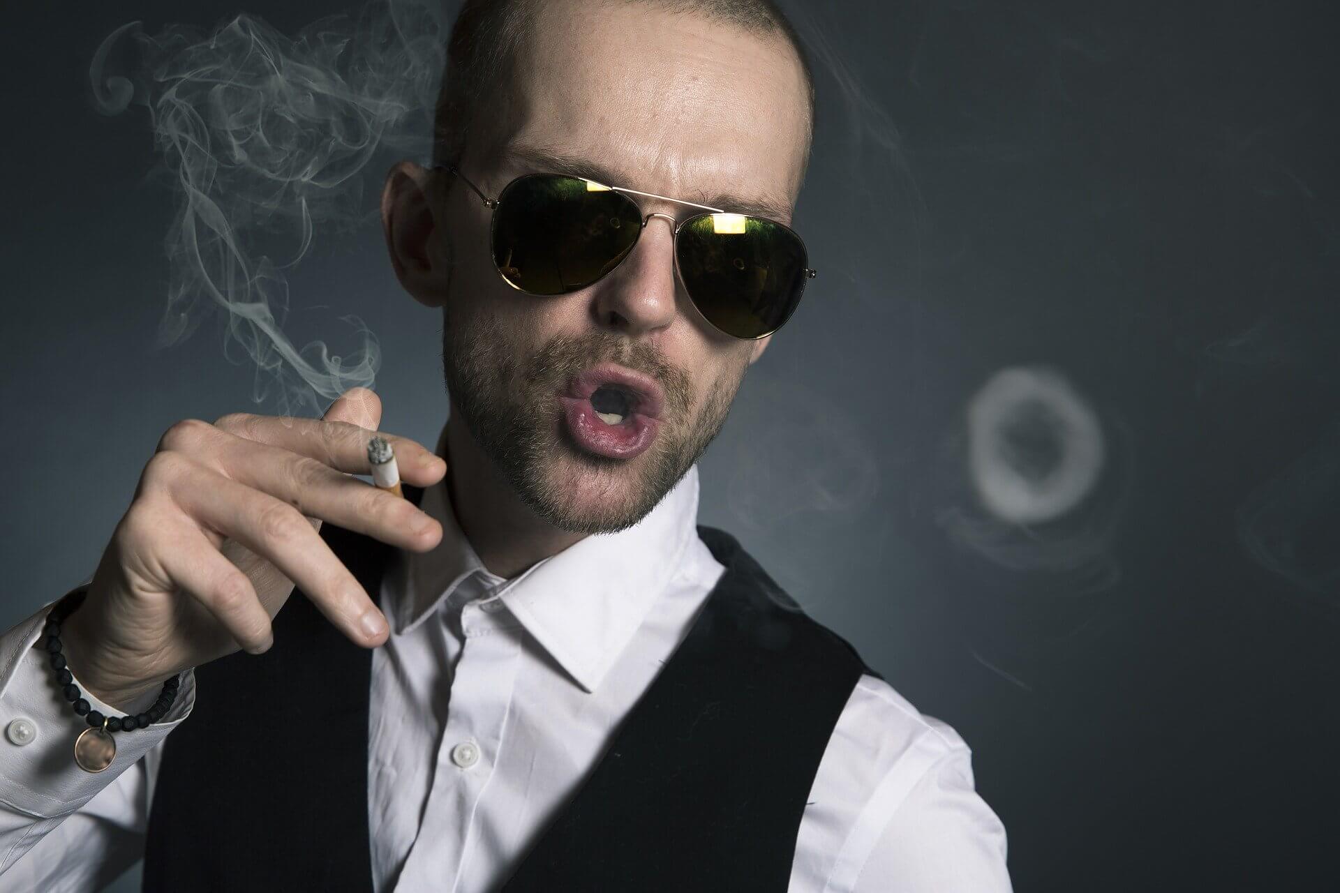 Narcisstic man smoking a cigarette