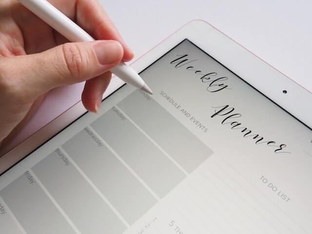 Person creating a monthly planner