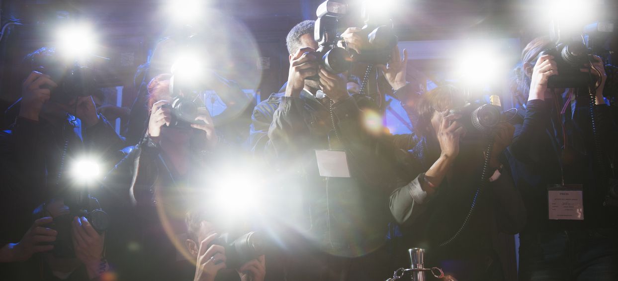 Paparazzi using flash photography at red carpet event - Steve Harwell's Death Concept Image